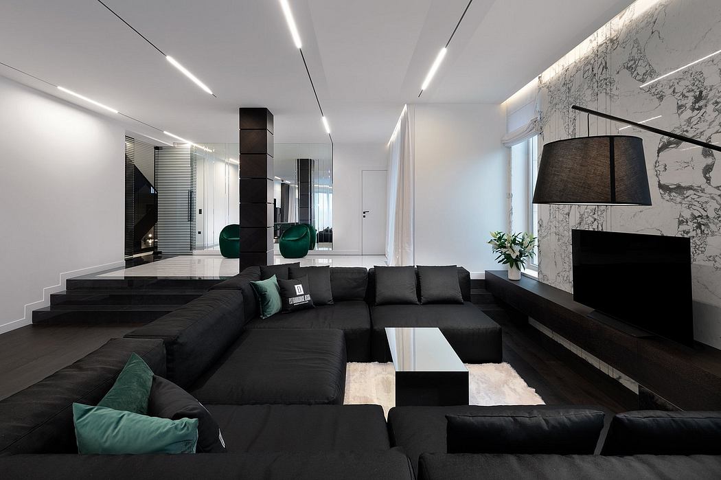 Sleek modern living space with minimalist black furnishings, marble accents, and recessed lighting.
