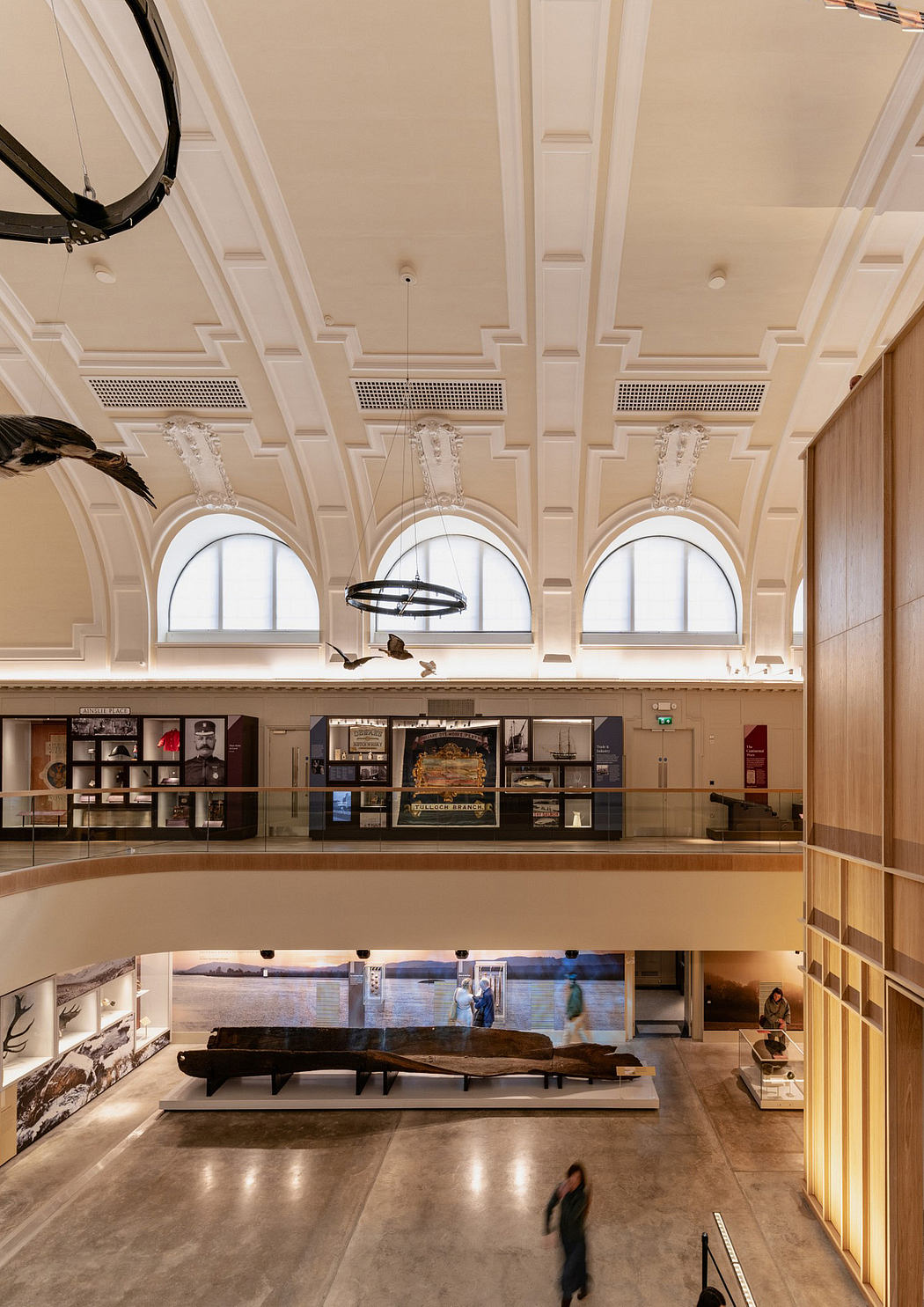 Ornate architectural details, arched windows, and a display of historical artifacts.