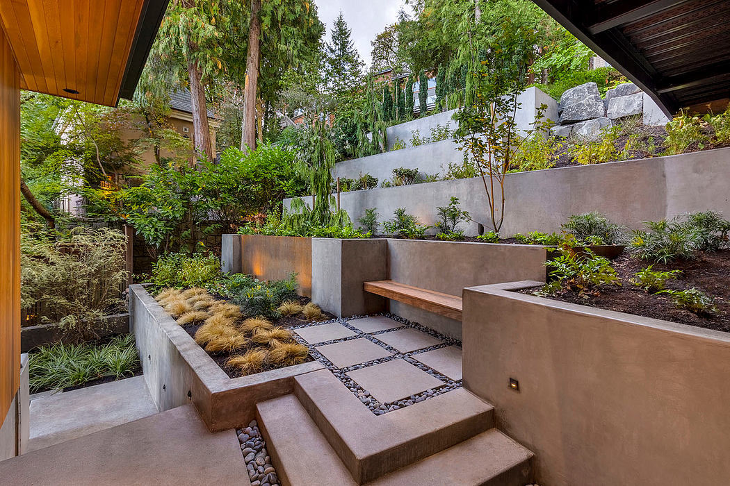 Lush garden with tiled paths, stone walls, and wood-beamed structure creating a serene oasis.