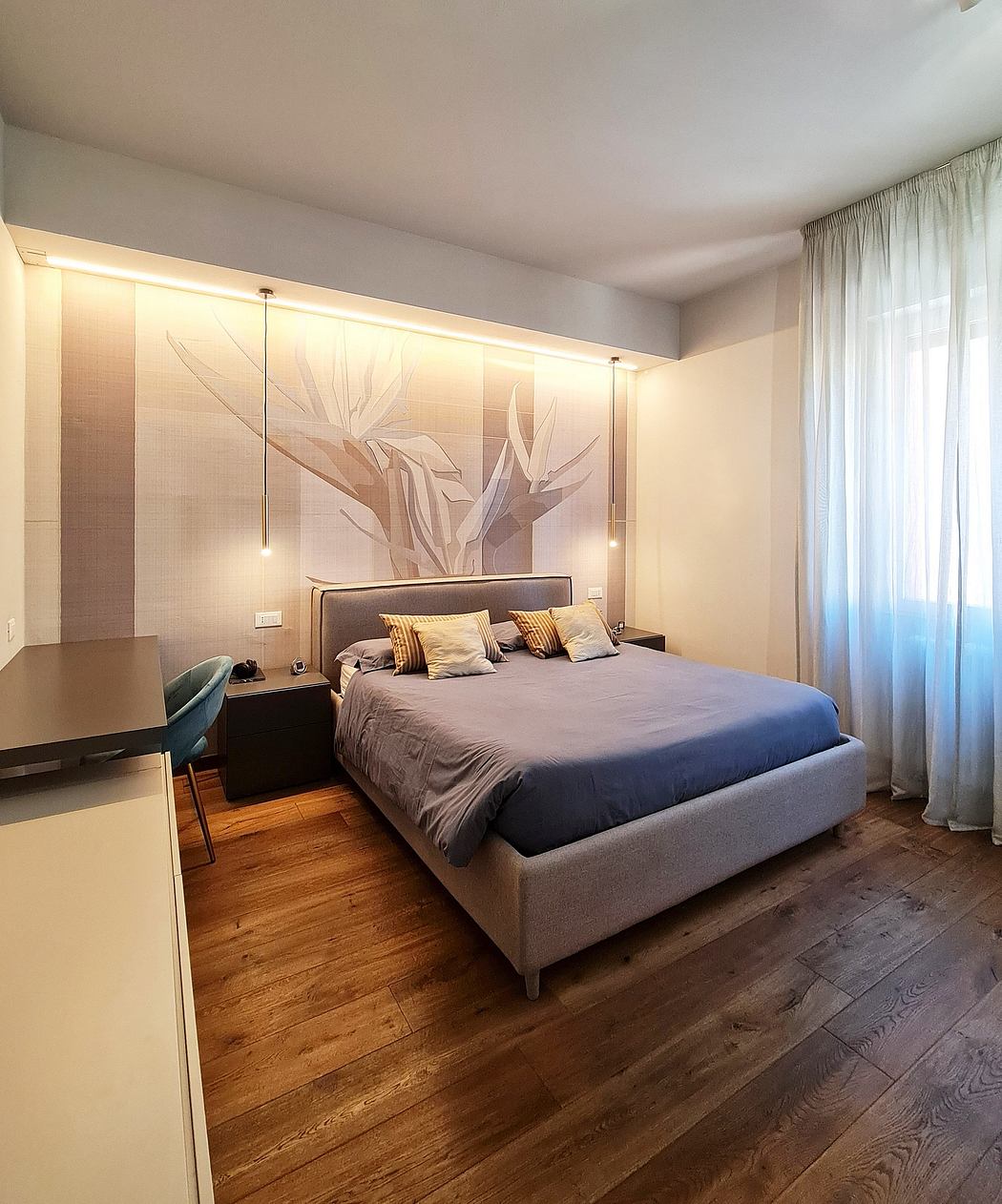 Elegant, modern bedroom with large mural wall, wood flooring, and recessed lighting.
