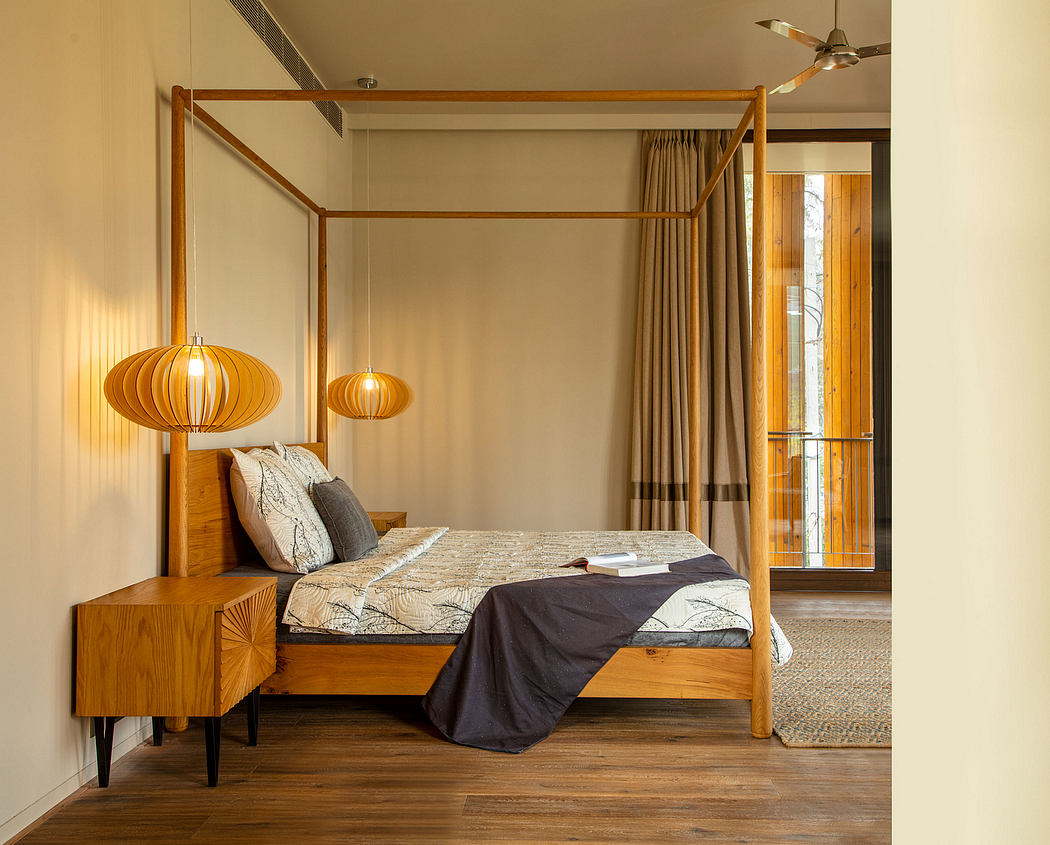 Cozy bedroom with canopy bed, wooden furnishings, and artistic pendant lamps.