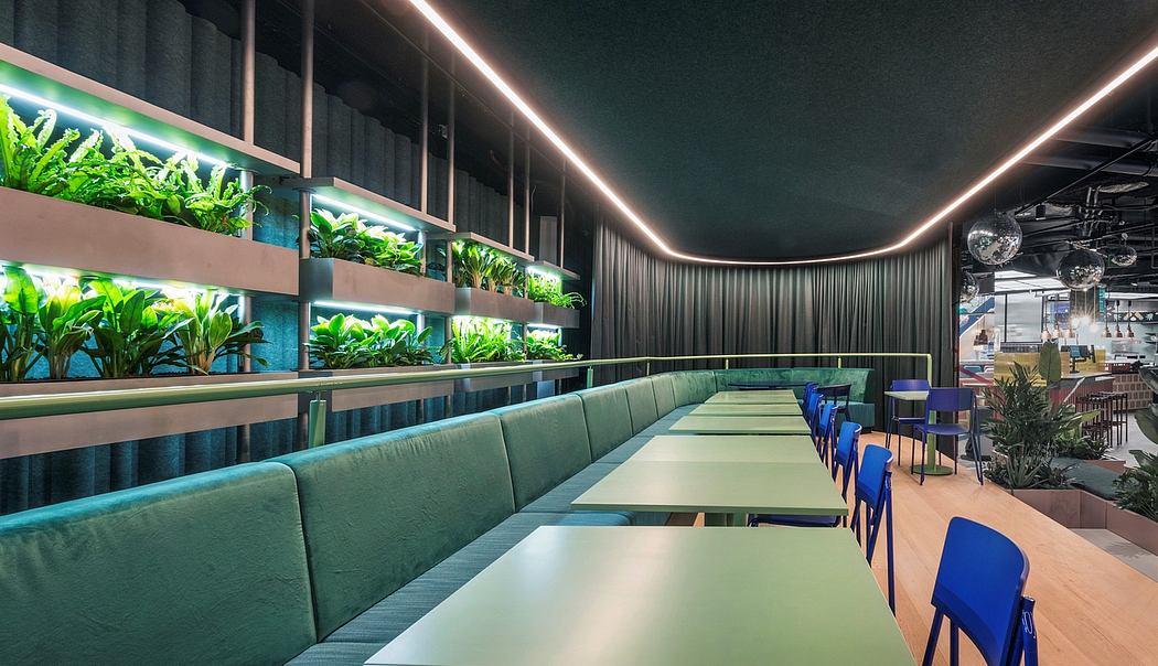 A stylish restaurant interior with lush greenery, modern lighting, and sleek seating.