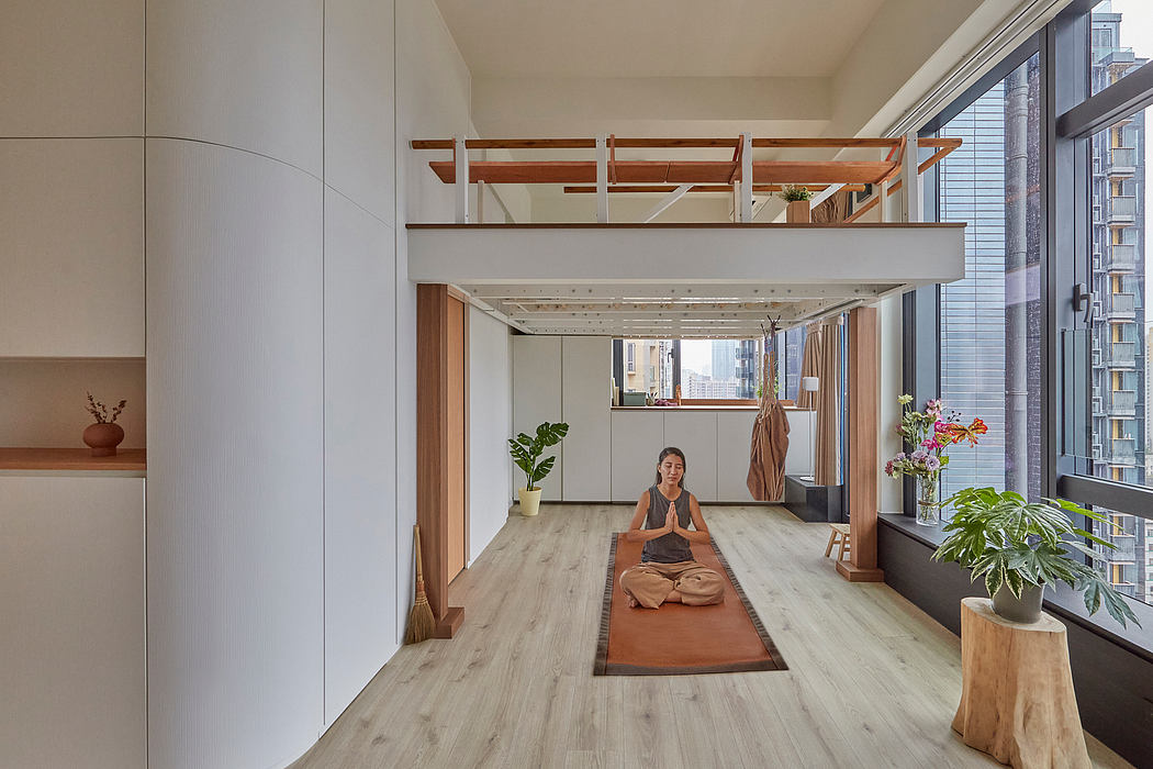 Minimalist, modern interior with warm wood accents and a person practicing yoga.