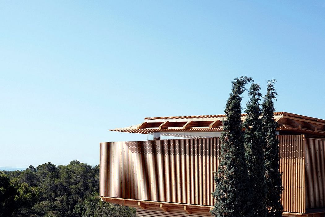 Wooden exterior with distinctive architectural features and lush greenery.