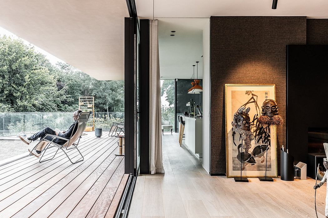 Minimalist modern interior with sleek wood floors, paneled walls, and expansive windows.