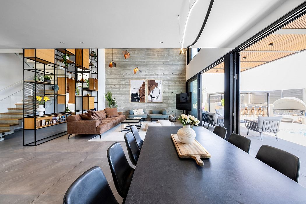 A modern, open-concept living area with a mix of industrial and rustic elements.