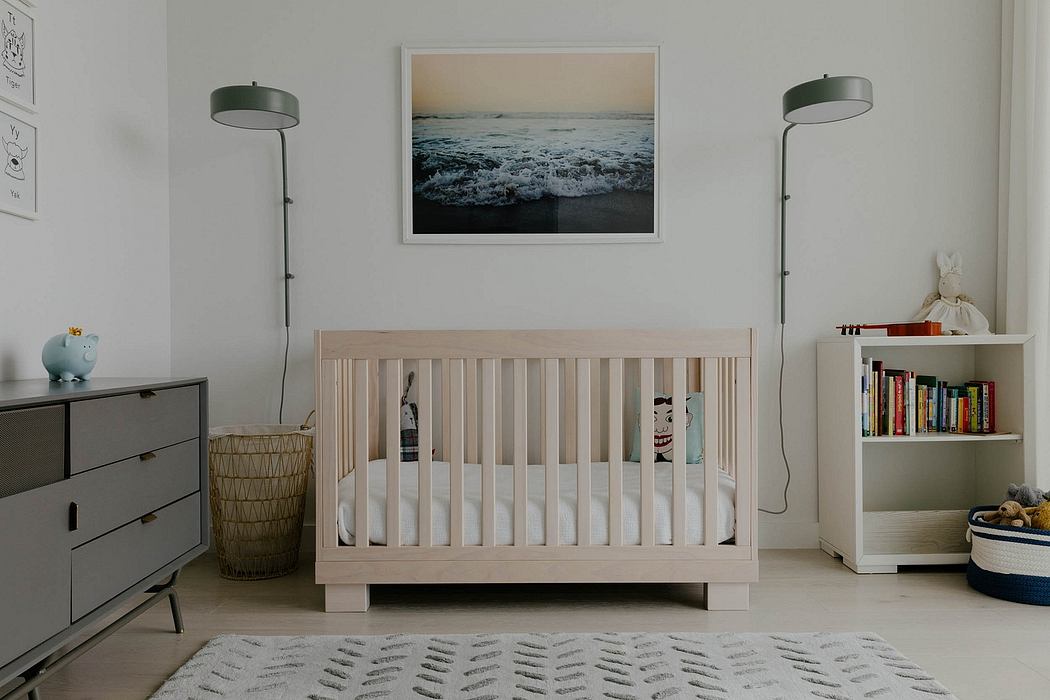 A cozy nursery with a wooden crib, shelves, and artwork highlighting a coastal scene.