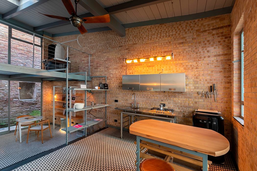 A cozy, industrial-inspired kitchen with brick walls, steel shelves, and a wooden countertop.