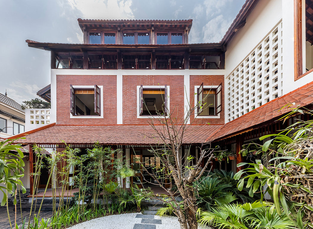 A traditional Chinese-style building with intricate wooden architecture and lush vegetation surrounding it.