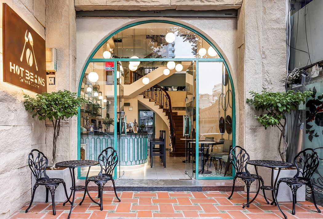Arched entryway with ornate, patterned tile floor and decorative lighting fixtures.