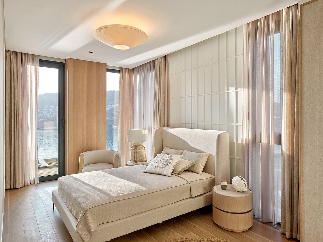 Serene bedroom with wooden accents, plush furnishings, and floor-to-ceiling windows offering scenic views.