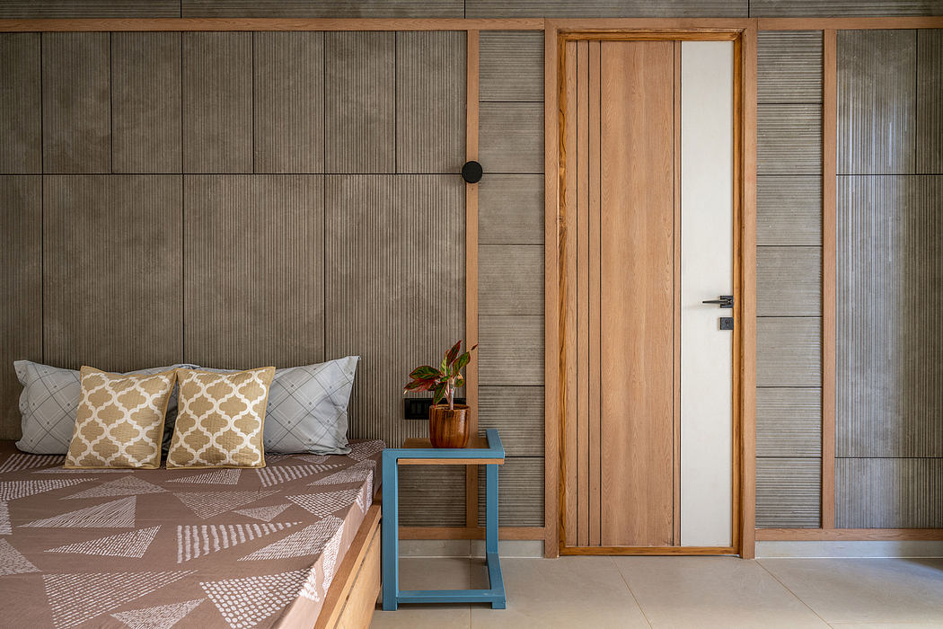 The image shows a modern, rustic-inspired interior design with wooden walls, a wooden door, and patterned decor.
