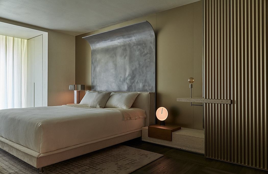 A modern and minimalist bedroom design with a large metal headboard and neutral tones.