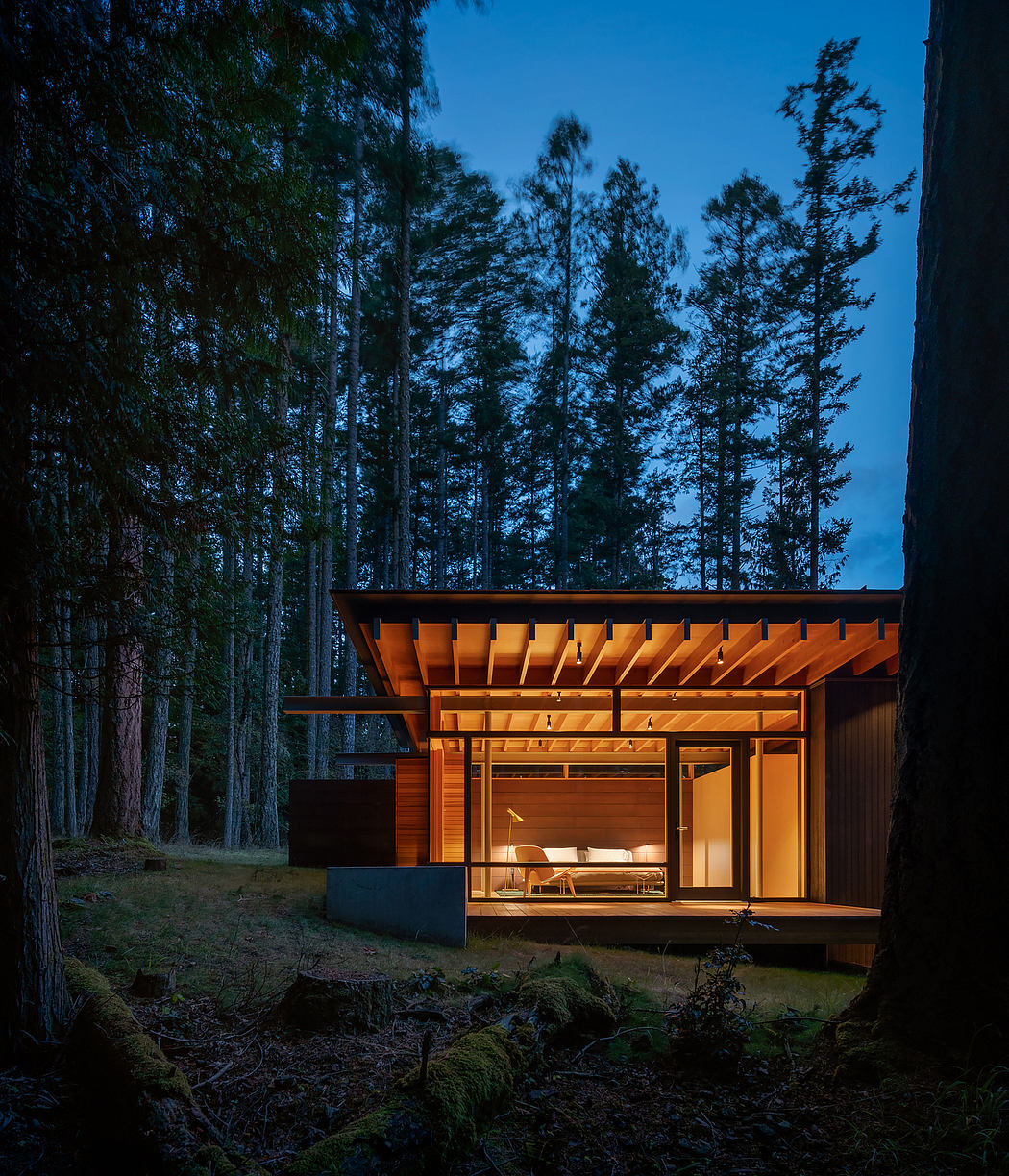 A cozy, wooden cabin nestled in a lush forest, with a warm glow emanating from its interior.
