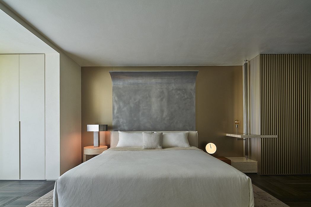 Minimalist bedroom with concrete accents, wood furnishings, and subtle lighting design.