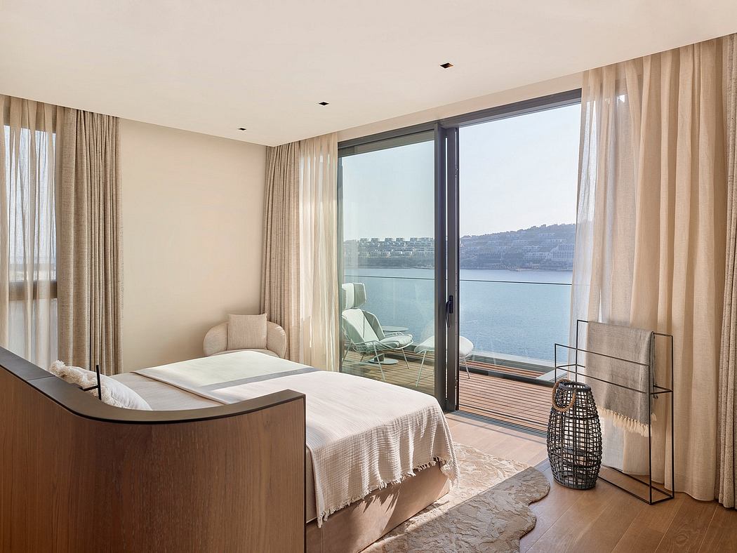 Spacious bedroom with floor-to-ceiling windows, plush furnishings, and serene views.
