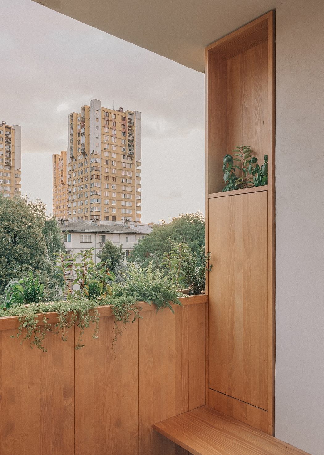Cozy modern balcony with wooden panels, lush greenery, and a view of the city skyline.