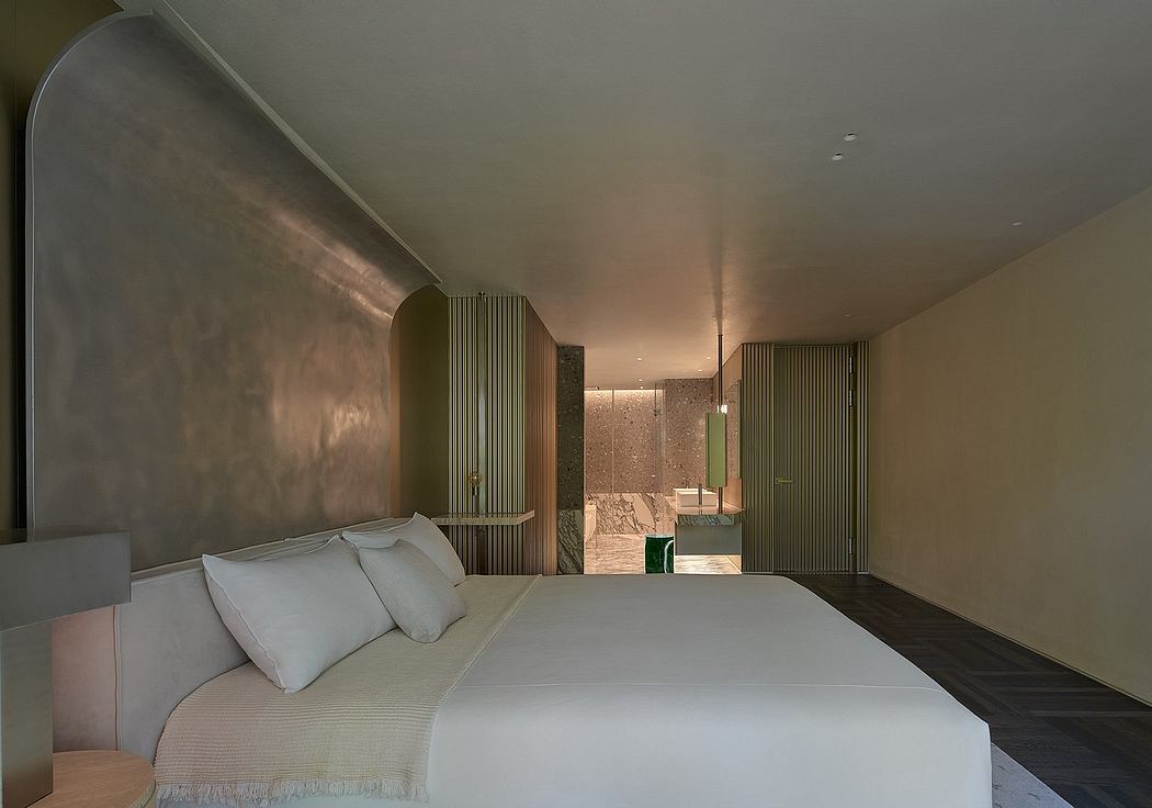 A minimalist bedroom with clean lines, textured walls, and an ensuite bathroom.