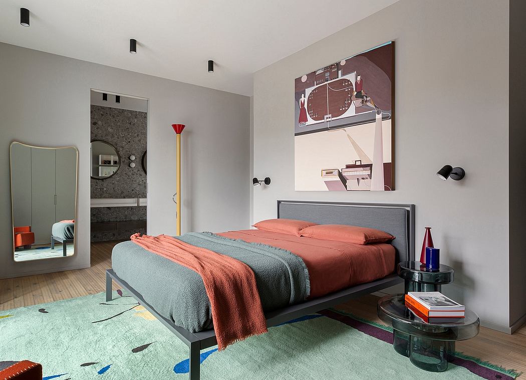 Modern bedroom with vibrant color palette, angular bed frame, and artistic wall decor.
