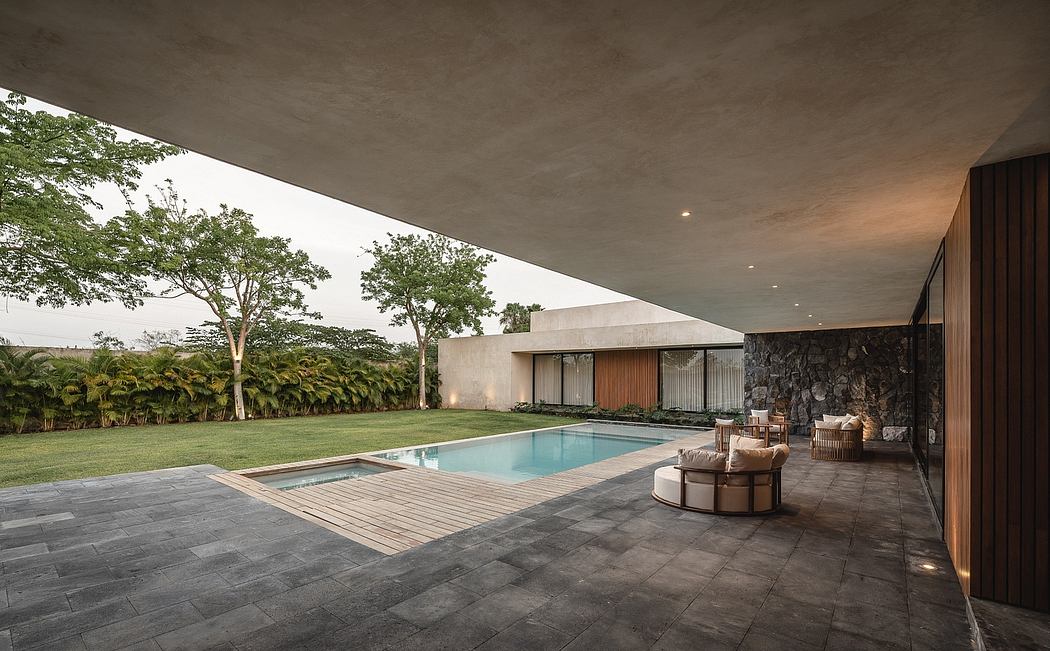 Expansive patio, sleek pool, lush garden - sophisticated outdoor living space.