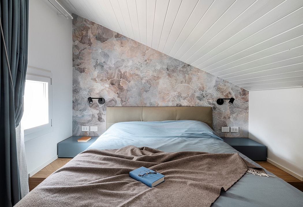 The image showcases a modern bedroom design with a textured stone accent wall and a minimalist bedframe.