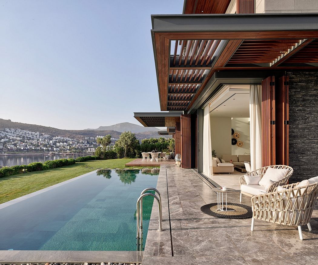 Contemporary architecture with wooden beams, stone walls, and an infinity pool overlooking a coastal cityscape.