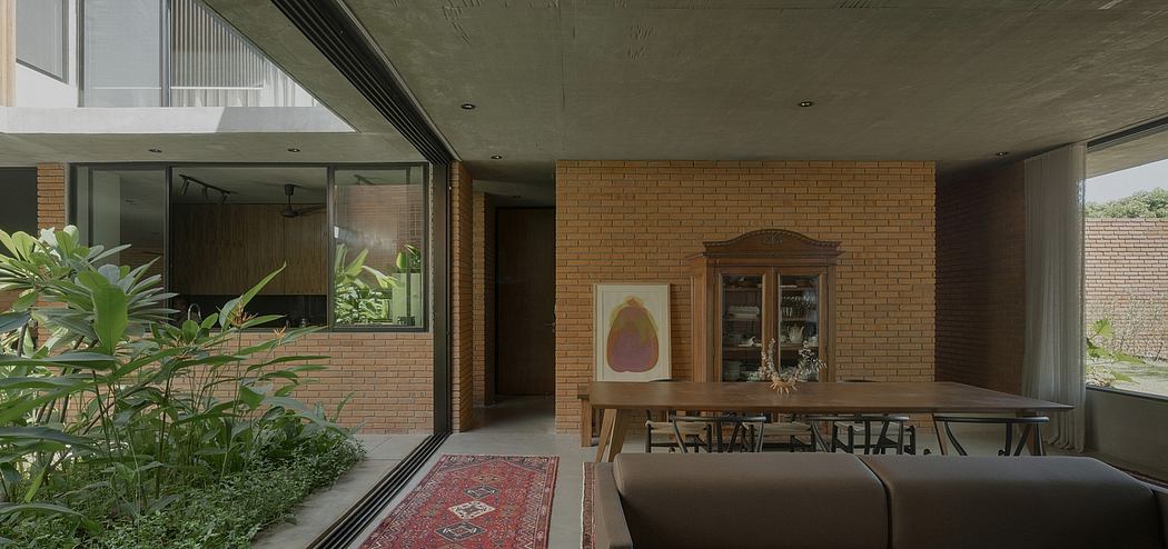 Modern interior with brick walls, large windows, and wooden furniture. Spacious and airy design.