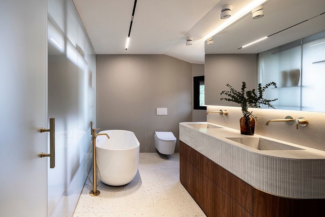 Sleek, modern bathroom with wood vanity, vessel sinks, and clean lines throughout.