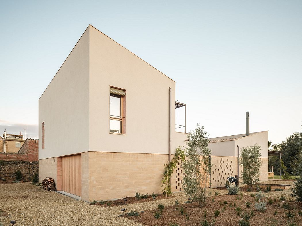 A contemporary minimalist house with clean lines, natural materials, and a lush garden.