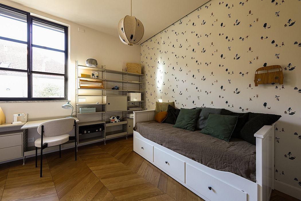 A cozy bedroom with a patterned wallpaper, shelves, and a daybed with storage drawers.