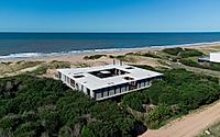 020-big-fish-elevated-home-blends-with-uruguays-wild-dunes.jpg