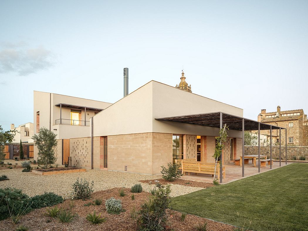 Modern desert-inspired building with stone walls, wood accents, and domed roof structure.