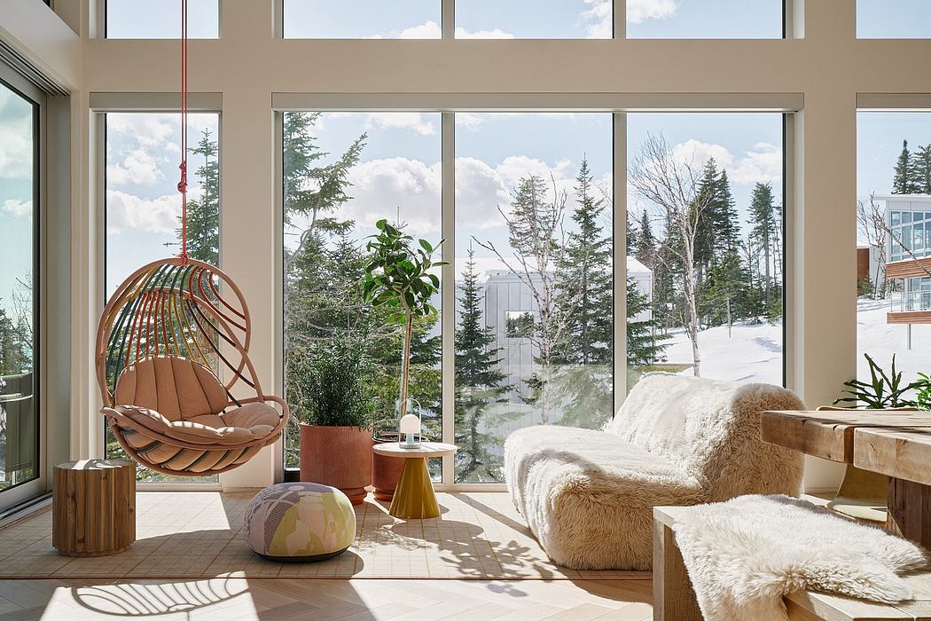 Cozy modern living room with large windows, hanging rattan chair, and plush fur furnishings.