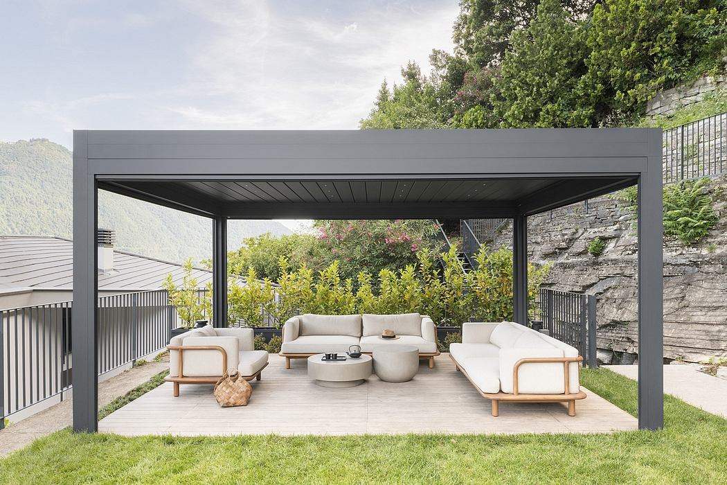 Sleek, modern pergola with minimalist outdoor seating and lush surrounding greenery.