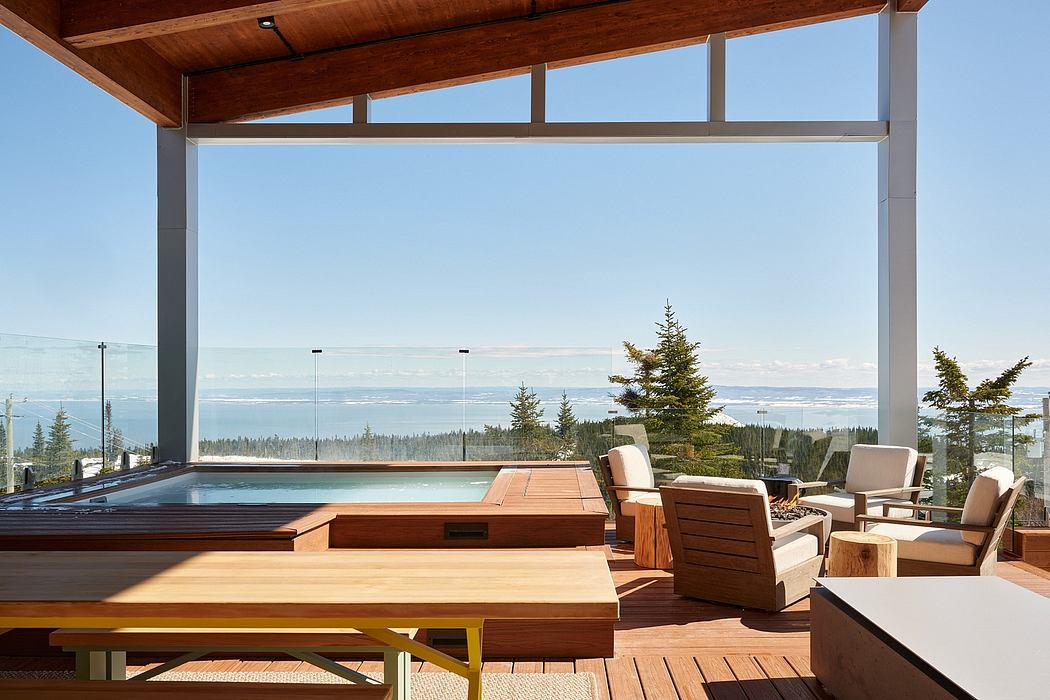 Spacious outdoor deck with wooden furnishings, expansive views, and a modern architectural style.