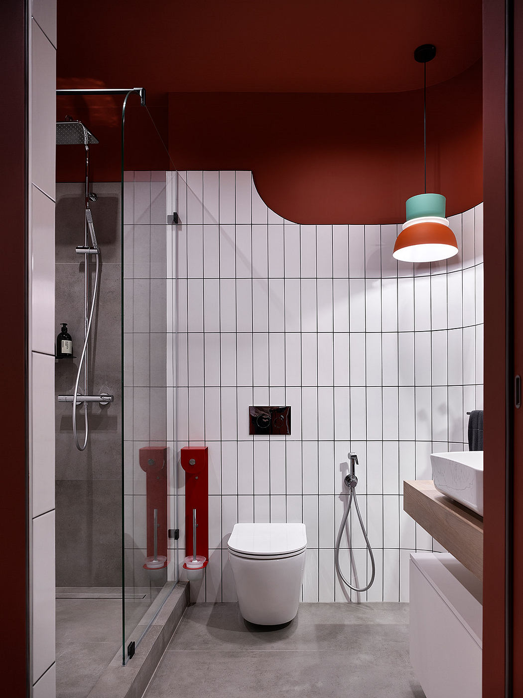 Modern bathroom with minimalist design, colorful lighting, and sleek fixtures.
