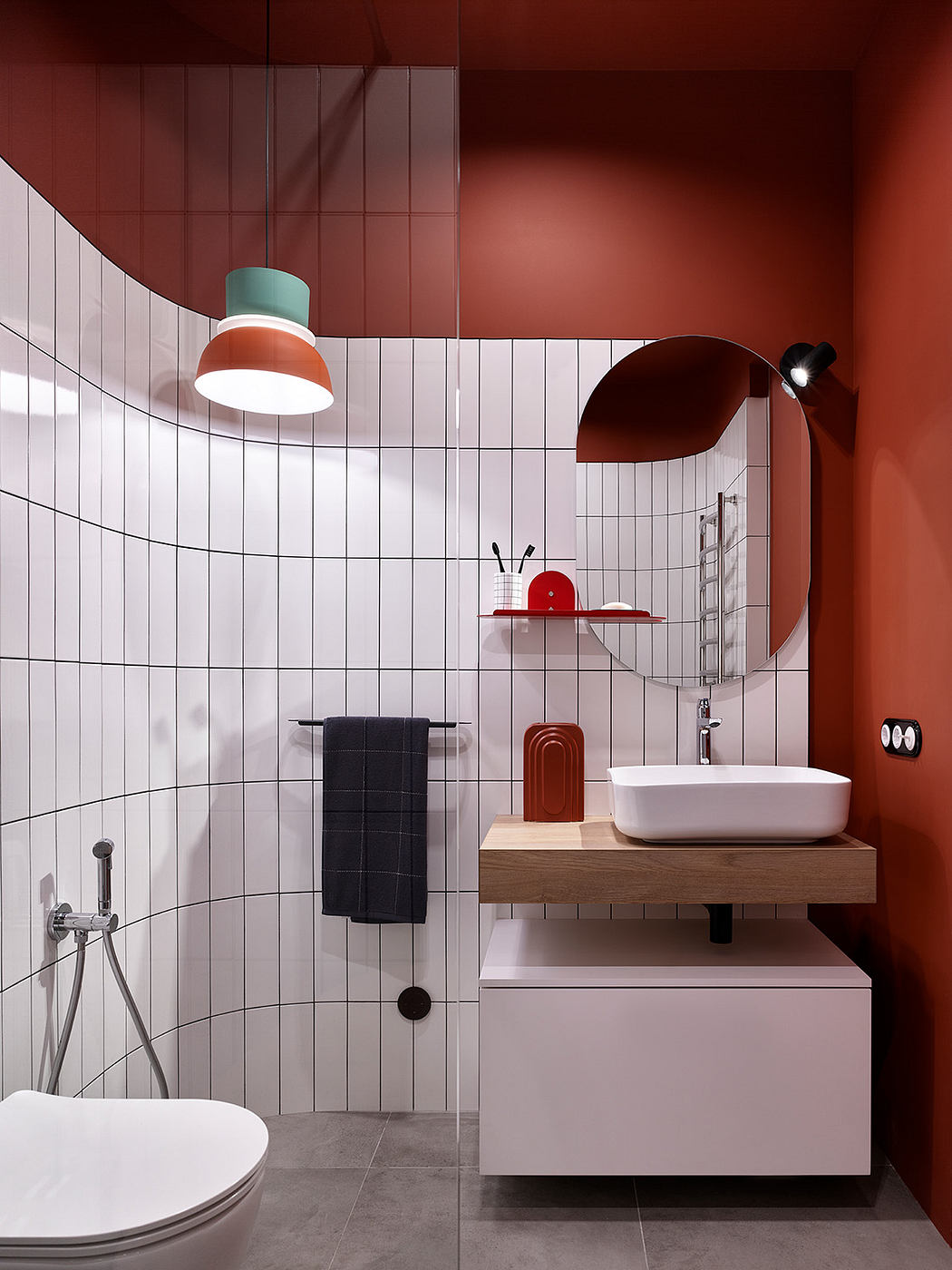 A modern, colorful bathroom with playful lighting and minimalist fixtures.
