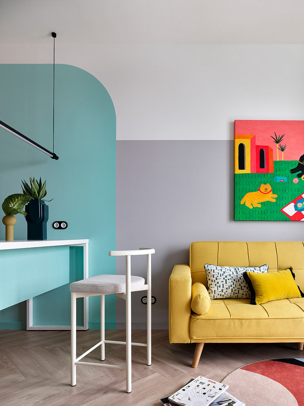 Vibrant, modern living room with colorful furniture, bold wall accents, and geometric shapes.