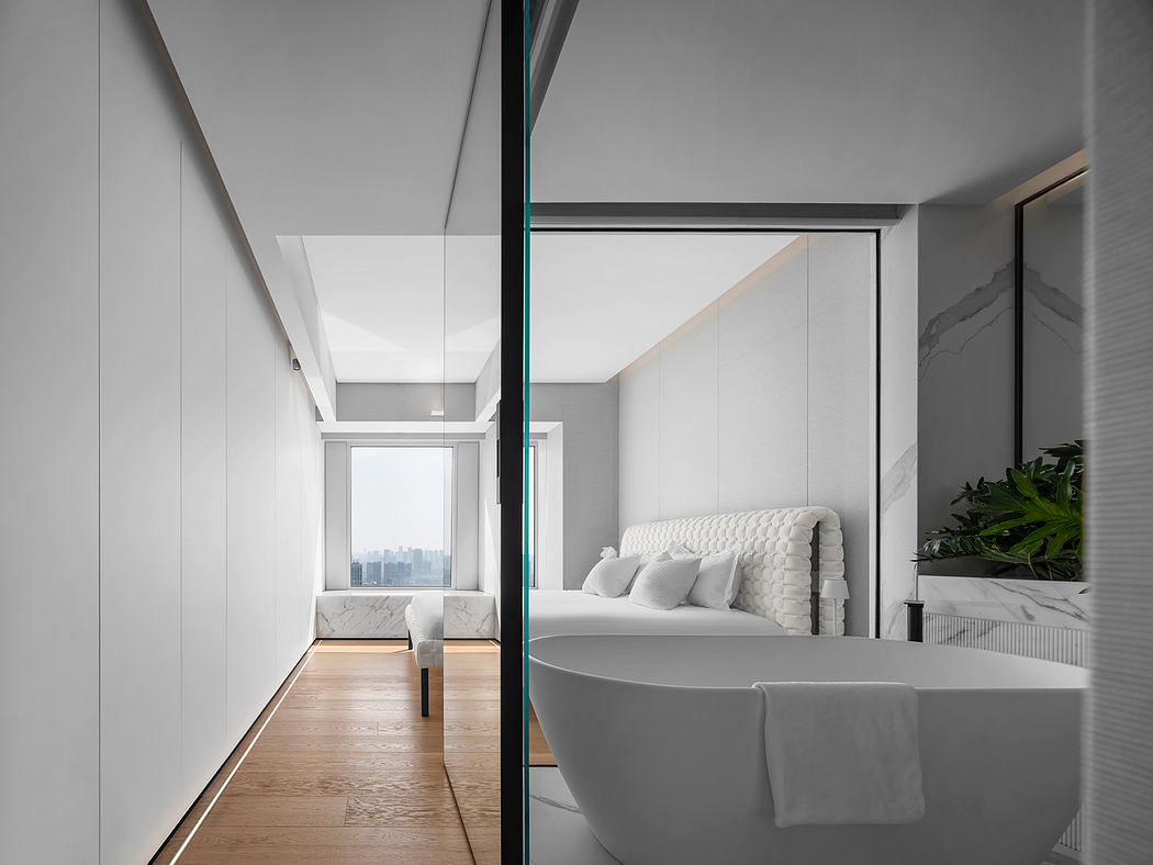 Minimalist modern bedroom with floor-to-ceiling windows, tufted headboard, and freestanding tub.