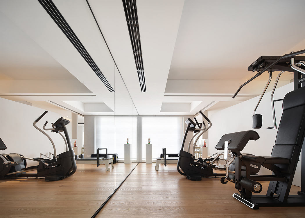 Sleek, modern fitness studio with minimalist design elements and state-of-the-art equipment.