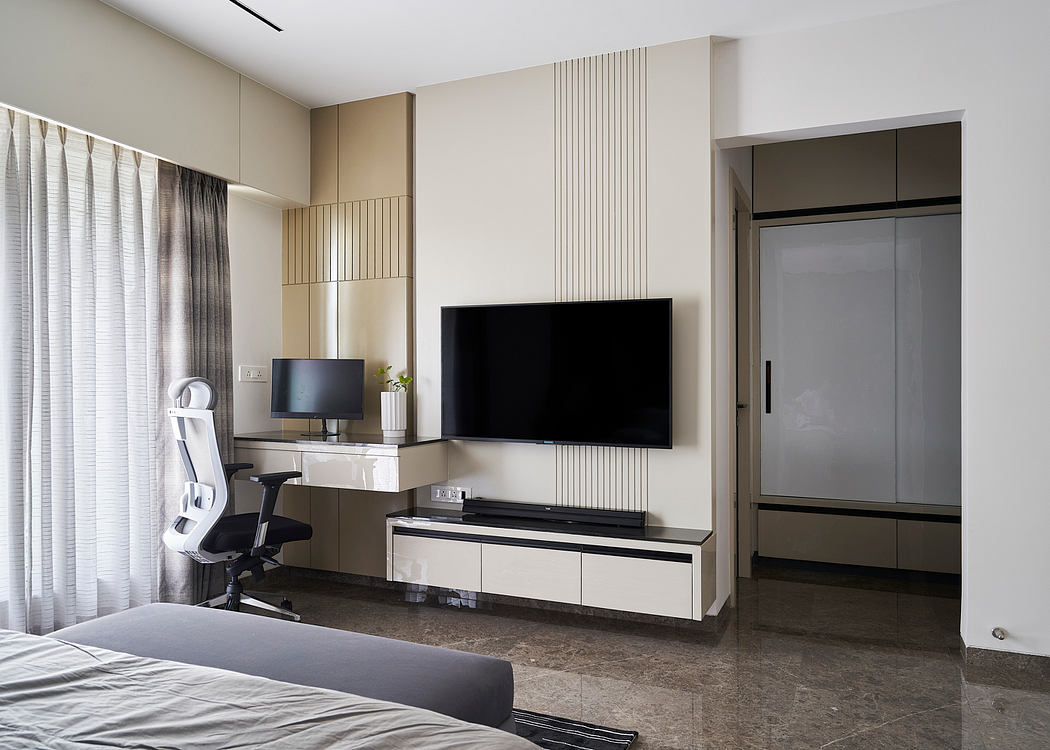 Modern bedroom interior with sleek furniture, wall panels, and TV console. Minimalist design.