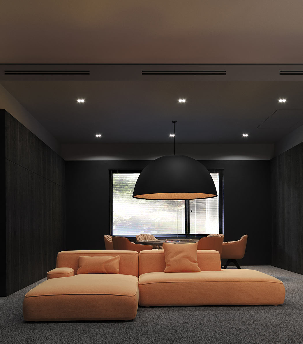 Modern living room with large sectional sofa, black pendant lamp, and minimalist decor.