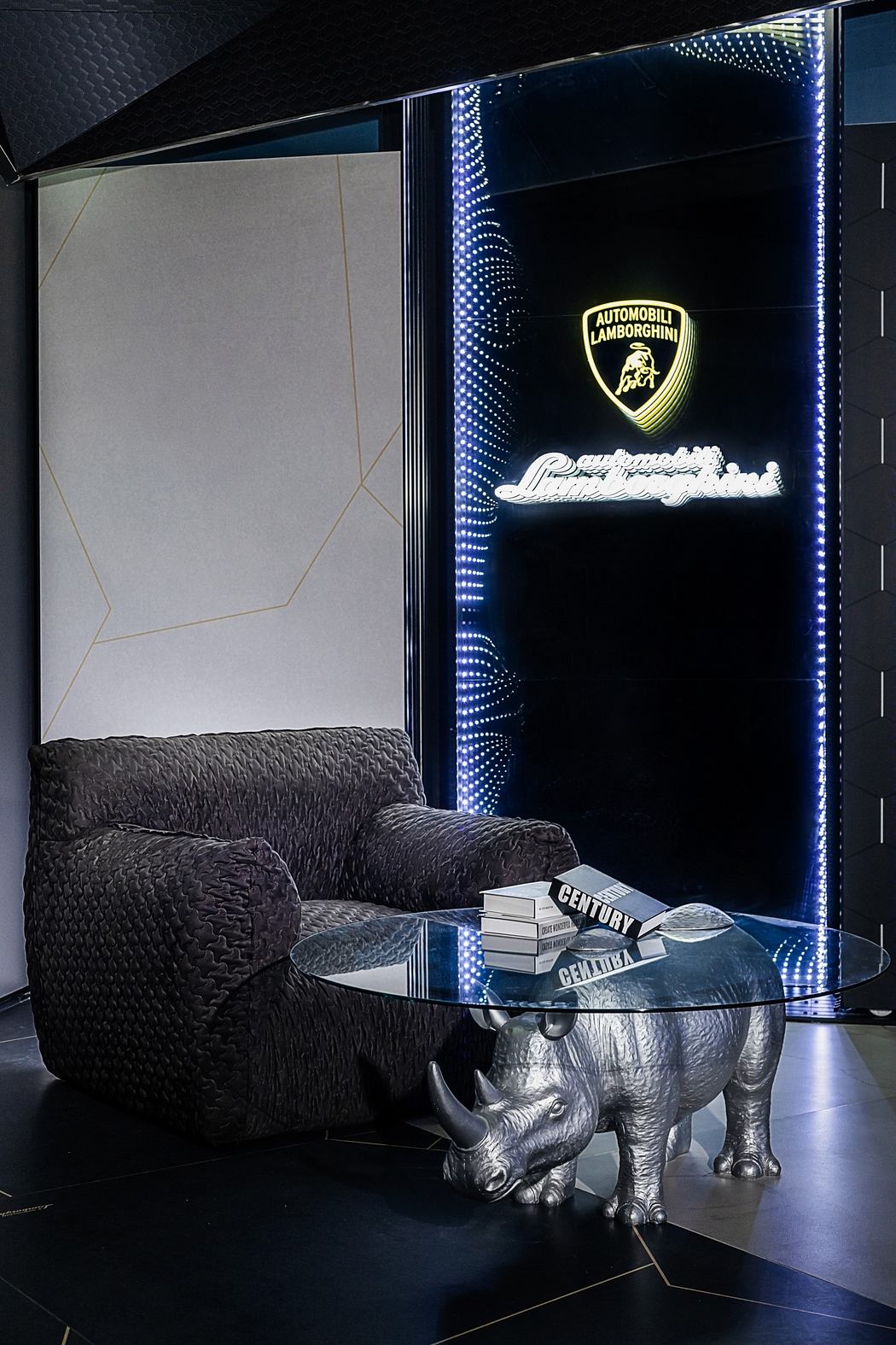 Sleek black interiors with intricate lighting and a rhinoceros-shaped table.