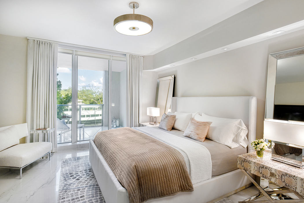 Spacious and elegant bedroom with large windows, modern lighting, and minimalist decor.