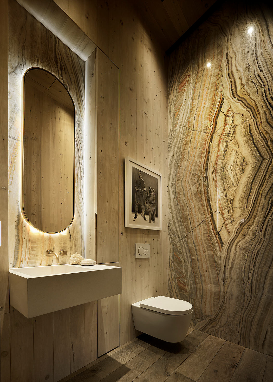 Intimate bathroom showcases natural stone textures, sleek vanity, and recessed lighting.