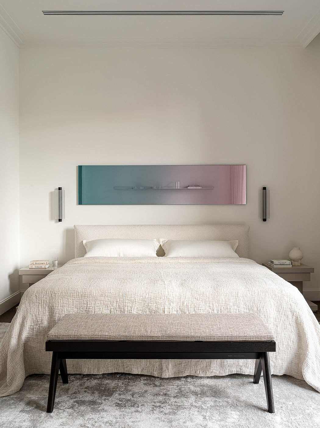 Modern bedroom with minimalist decor, neutral tones, and a geometric shelving unit.