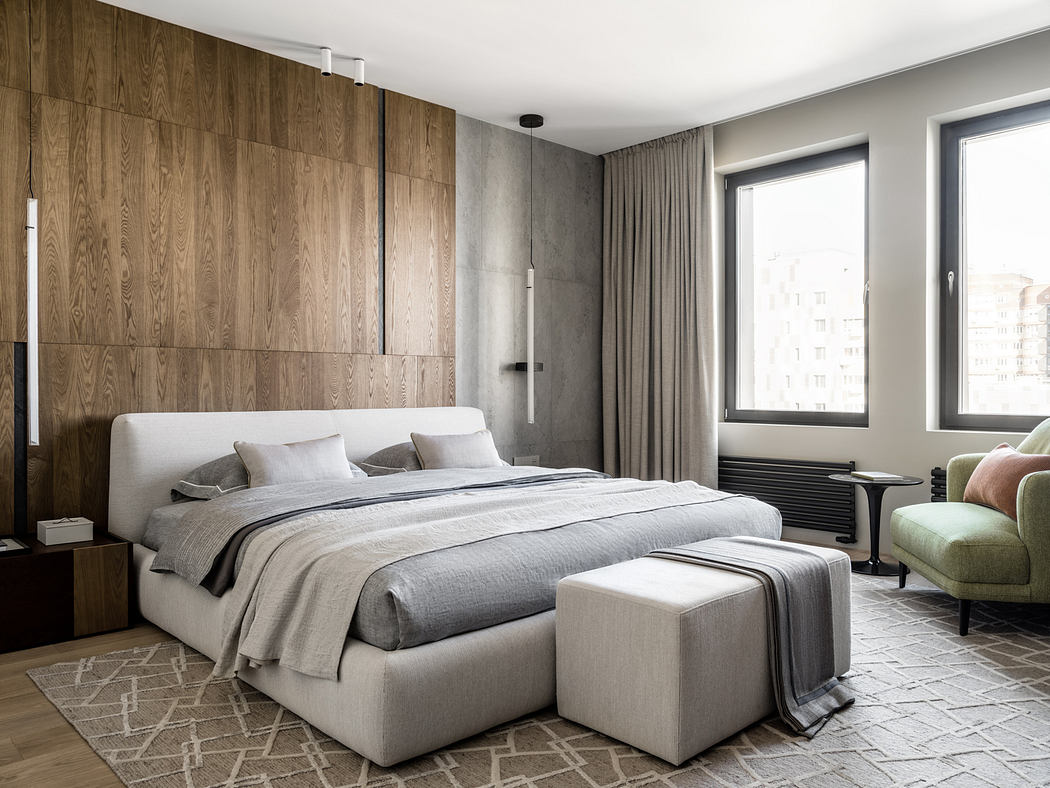 A modern, minimalist bedroom with wood-paneled walls, a large bed, and an area rug.