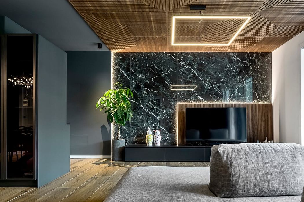 Sleek contemporary living room with dark marble feature wall, wood ceiling, and modern furnishings.