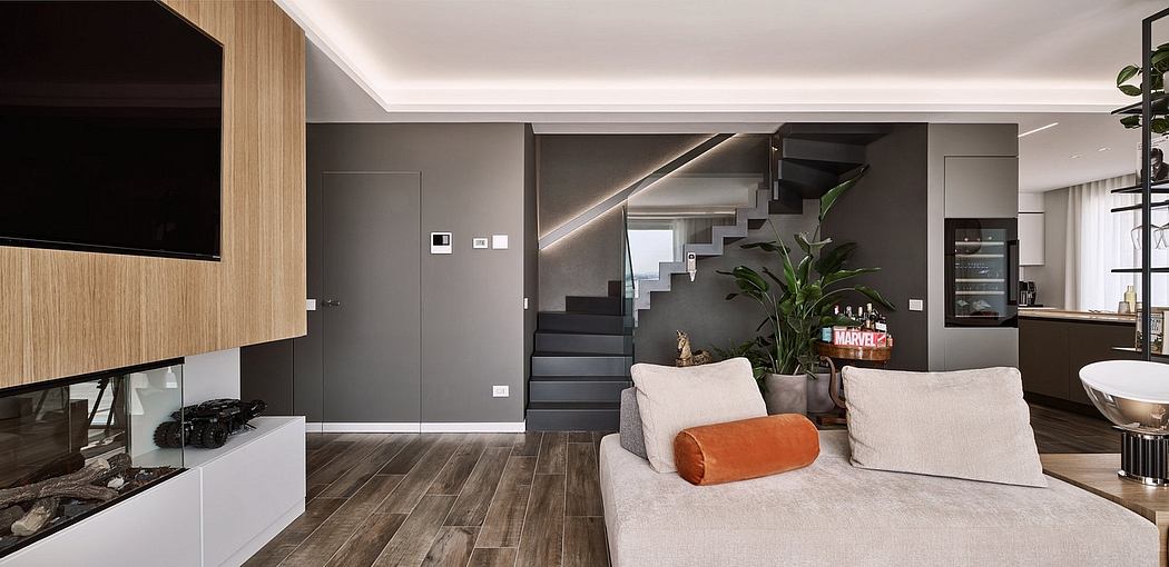 Spacious modern living room with wood-paneled walls, floating media cabinet, and spiral staircase.