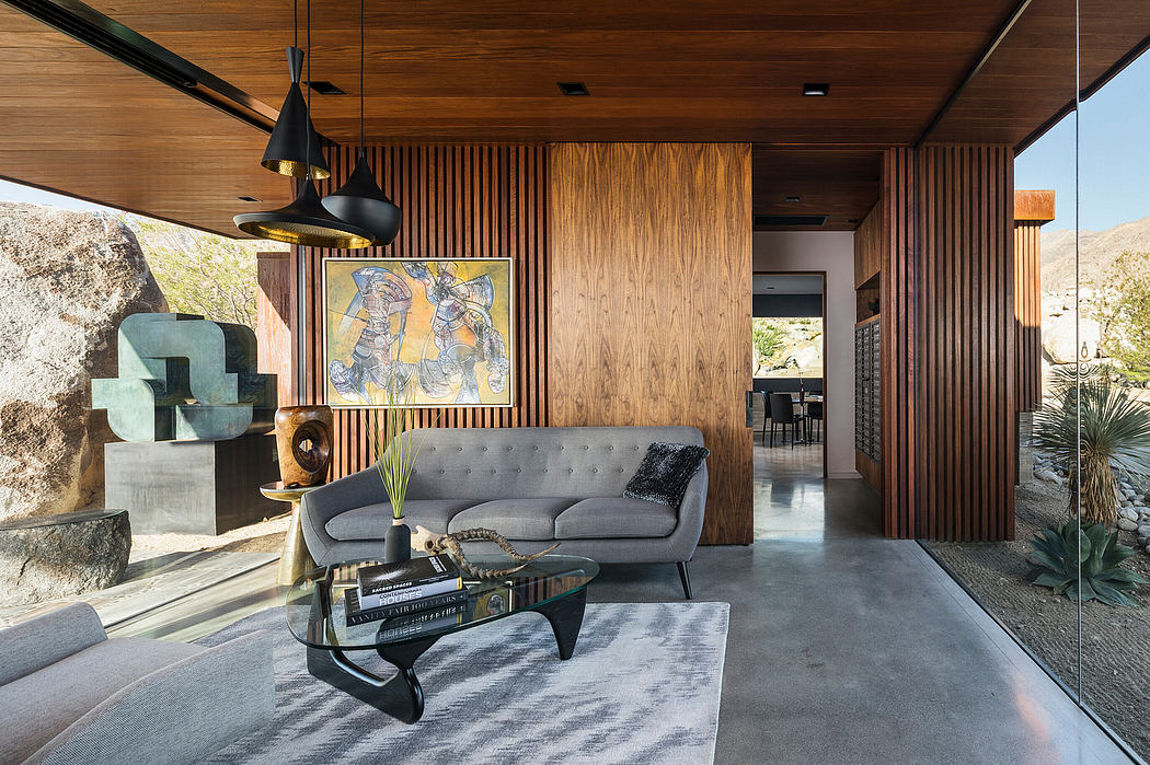 Warm, earthy tones with sleek furniture, pendant lights, and textured wood paneling.